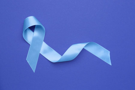 Awareness ribbon on blue background. Prostate cancer conceptの写真素材