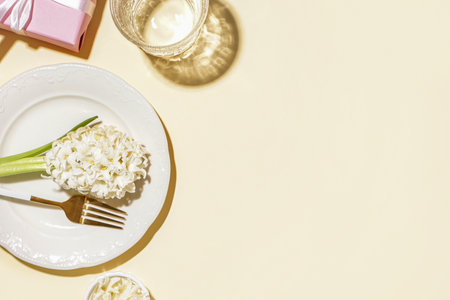 Clean plate with beautiful hyacinth flower on beige backgroundの写真素材