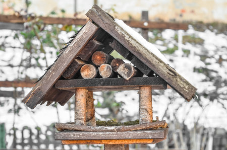 View of wooden bird house covered with snow on winter day, closeupの写真素材
