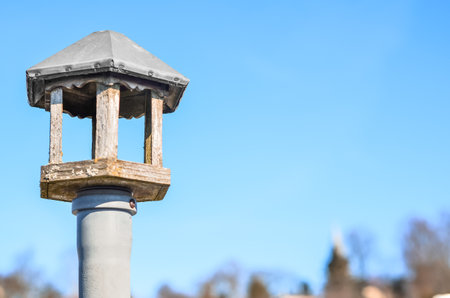 View of wooden bird house against blue sky, closeupの写真素材