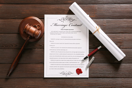 Marriage contract with judge gavel on wooden backgroundの写真素材