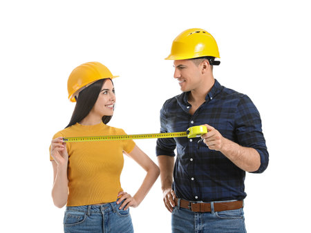 couple with measuring tape on white backgroundの写真素材