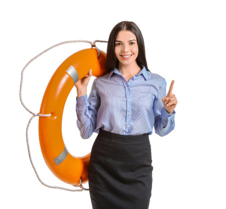 Young businesswoman with lifebuoy on white backgroundの写真素材