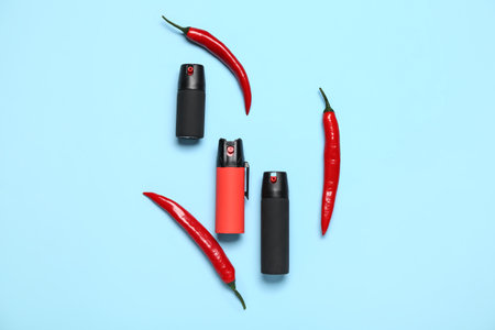 Sprays with chili peppers on blue backgroundの写真素材