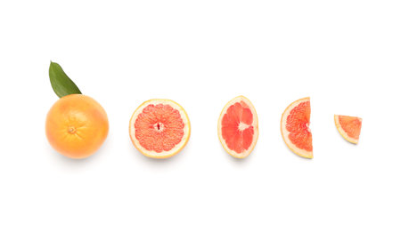 Composition with whole and cut grapefruits on white backgroundの写真素材
