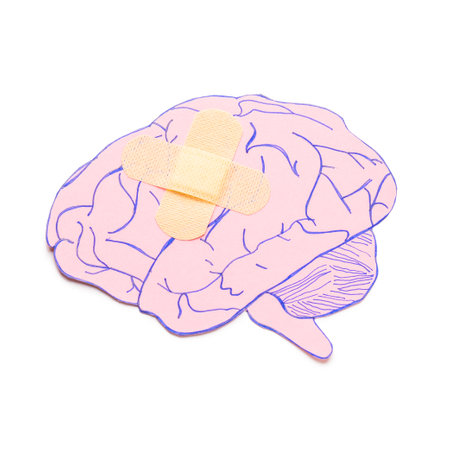 Paper brain and patch on white background. concept of dementiaの写真素材