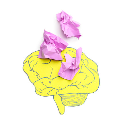 Brain and crumpled paper pieces on white background. concept of dementia