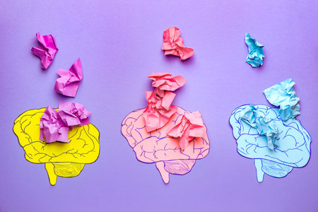 Human brains and crumpled paper pieces on color background. concept of dementiaの写真素材