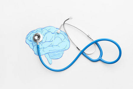 Paper human brain and stethoscope on white background. concept of dementiaの写真素材