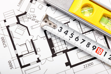 Measuring tape with ruler and blueprintの写真素材