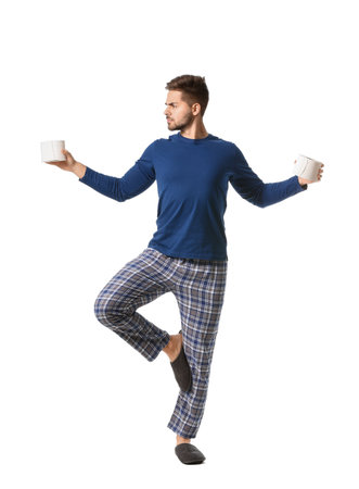 Meditating young man with toilet paper on white backgroundの写真素材