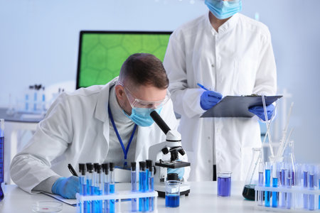 Scientists working with samples in laboratoryの写真素材