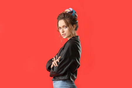 Beautiful young woman with unusual hair on color background