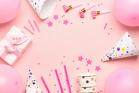 Frame made of different party decor on pink backgroundの写真素材