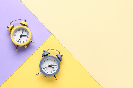 Vintage alarm clocks on color backgroundの写真素材