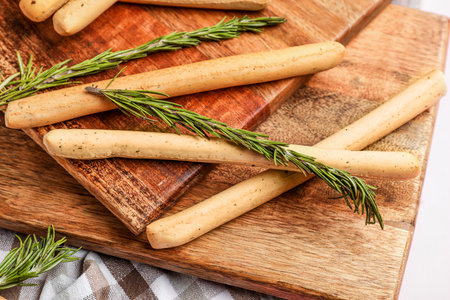 Wooden boards with tasty Italian Grissini, closeupの写真素材