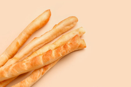 Tasty Italian Grissini on yellow background, closeupの写真素材