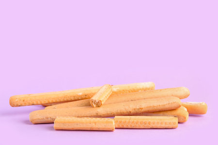 Tasty Italian Grissini on lilac backgroundの写真素材