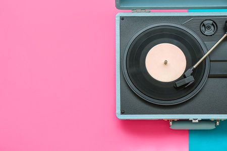 Record player with vinyl disk on color backgroundの写真素材