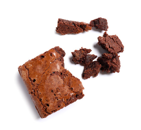 Pieces of tasty chocolate brownie isolated on white backgroundの写真素材