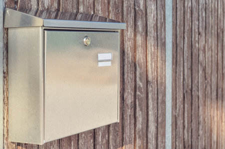View of mailbox on wooden fence outdoors, closeupの写真素材