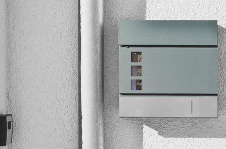 View of mailbox on white building wallの写真素材