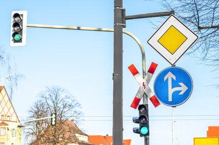 View of traffic lights with road signs in cityの写真素材
