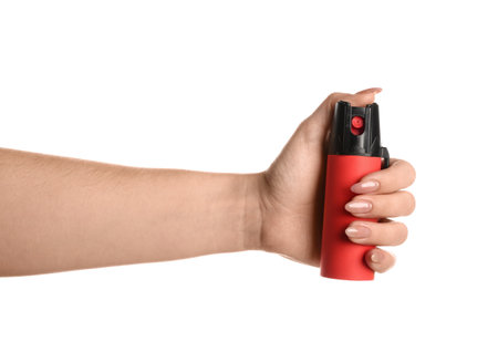 Woman with pepper spray on white backgroundの写真素材
