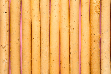 Tasty Italian grissini as backgroundの写真素材