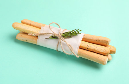 Bunch of tasty Italian Grissini on turquoise backgroundの写真素材