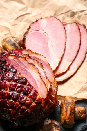Tasty smoked ham and grilled mushrooms on tableの写真素材