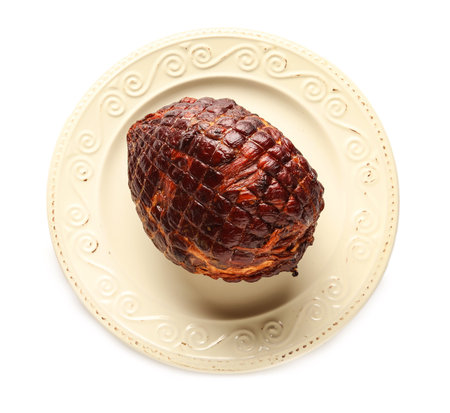 Plate with tasty smoked ham isolated on white backgroundの写真素材
