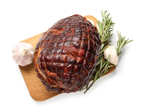 Wooden board with tasty smoked ham isolated on white backgroundの写真素材