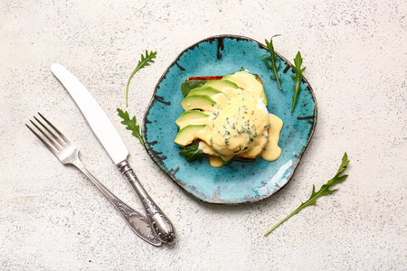 Plate with tasty egg Benedict on white tableの写真素材