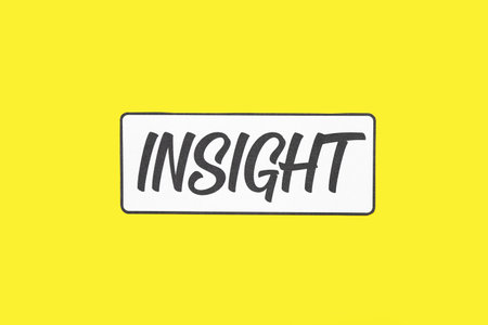Paper with word INSIGHT on yellow backgroundの写真素材