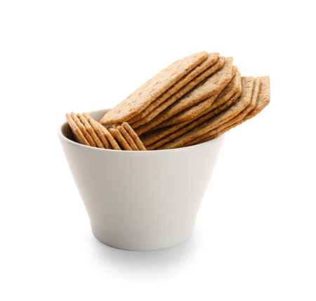 Bowl with tasty crackers isolated on white backgroundの写真素材