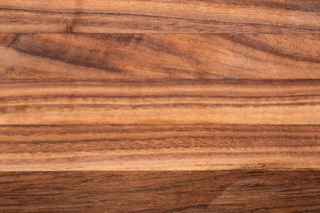 Wooden cutting board as background, closeupの写真素材