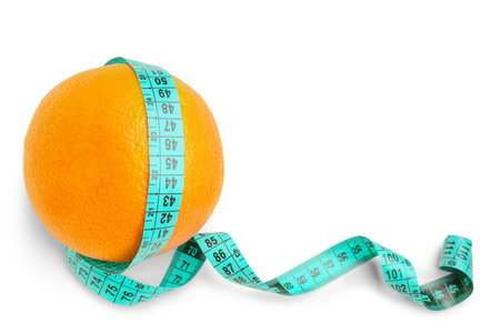 Orange and blue measuring tape on white background. Diet conceptの写真素材