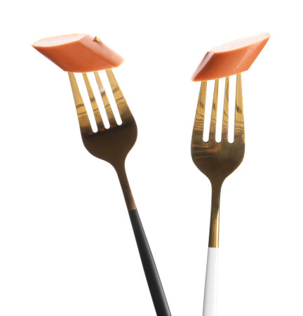 Forks with pieces of tasty sausage isolated on white backgroundの写真素材