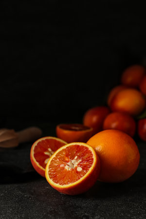 Tasty blood orange fruits on dark backgroundの写真素材