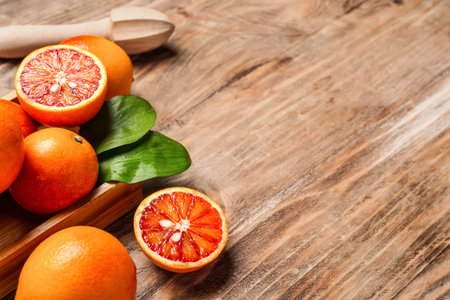 Box with tasty blood oranges on wooden backgroundの写真素材