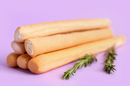Tasty Italian Grissini on lilac backgroundの写真素材