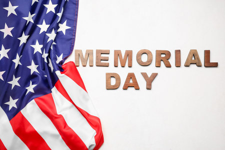 Text MEMORIAL DAY with USA flag on white backgroundの写真素材