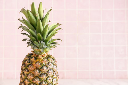 Fresh ripe pineapple on color tile backgroundの写真素材