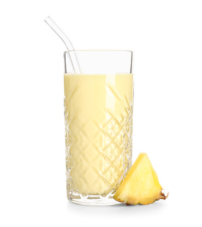 Glass of tasty smoothie with pineapple slice and straw on white backgroundの写真素材