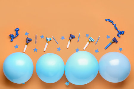 Different party decor on orange backgroundの写真素材