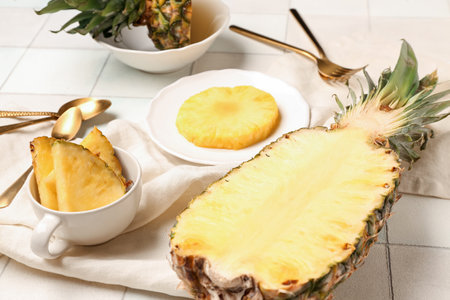 Fresh cut pineapple on white tile backgroundの写真素材