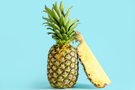 fresh cut pineapple on blue backgroundの写真素材