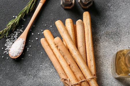 Bunch of tasty Italian Grissini on grunge background, closeupの写真素材