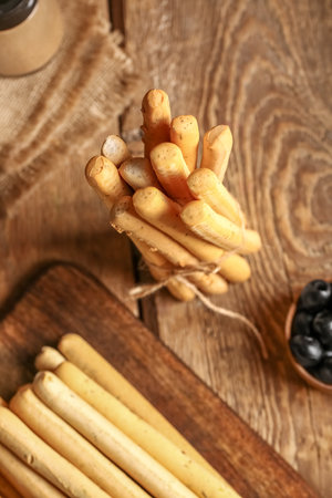 Bunch of tasty Italian Grissini on wooden backgroundの写真素材